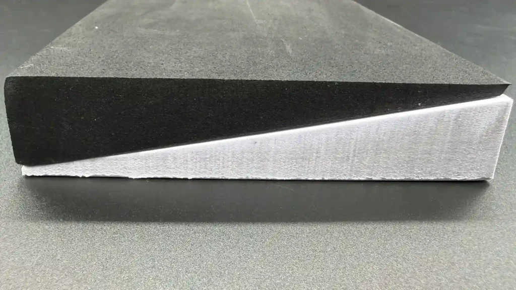 Black wire-cut and white bevel-cut EVA foam wedges stacked to show the tapered profile from 25 mm down to a 1 mm thin edge