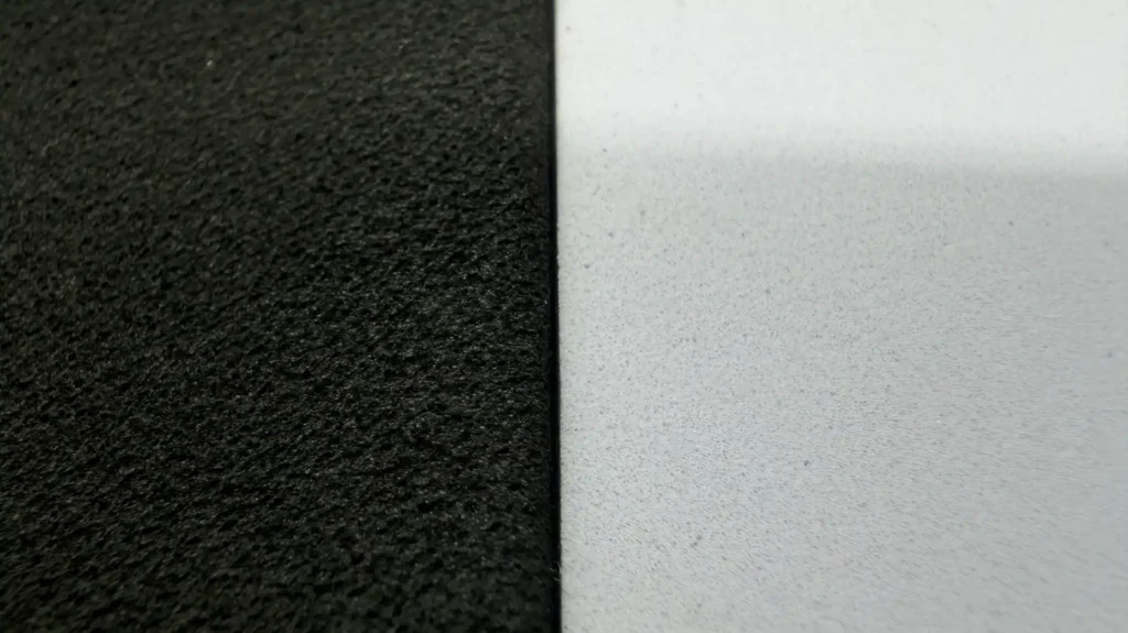Detail of the 1 mm thin edge of a bevel-cut EVA foam wedge showing sharp definition